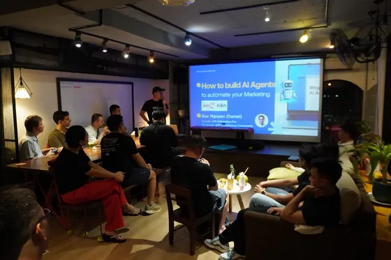 Daniel presenting to a small audience in a café-style room
