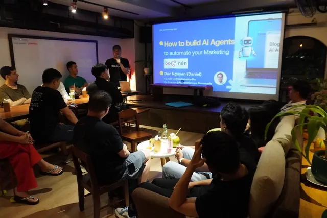 A small evening audience watching Daniel present How to build AI agents to automate your marketing