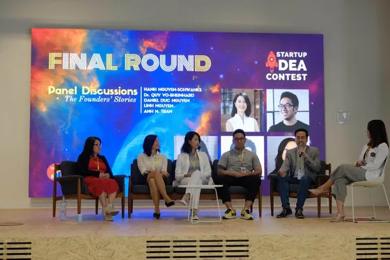Panel on stage under a screen reading Final round, startup idea contest