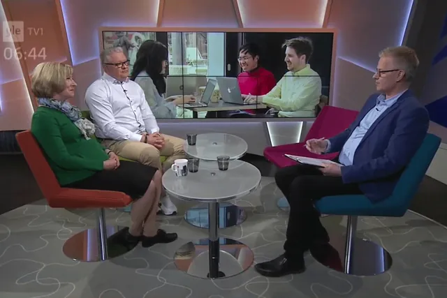 Studio of the Yle TV1 morning show with hosts and guests seated around a table